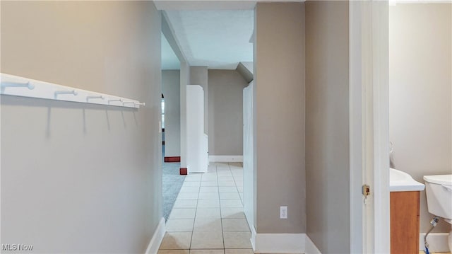 hall with light tile patterned flooring