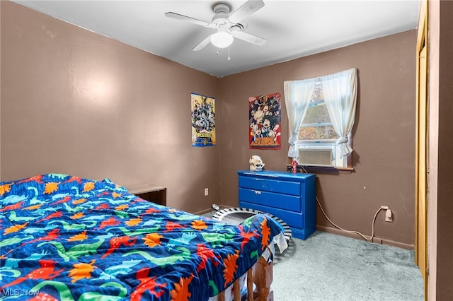 carpeted bedroom with ceiling fan and cooling unit