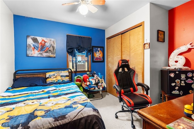 carpeted bedroom with a closet, cooling unit, and ceiling fan