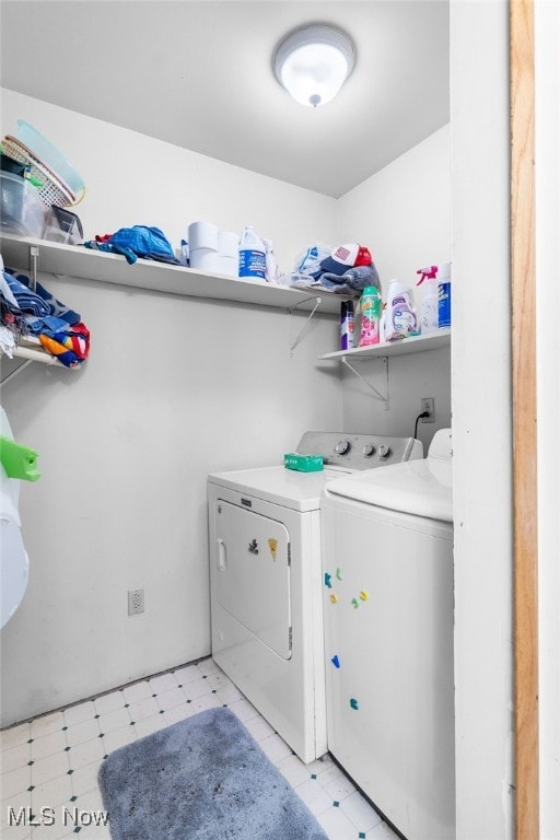 clothes washing area featuring independent washer and dryer