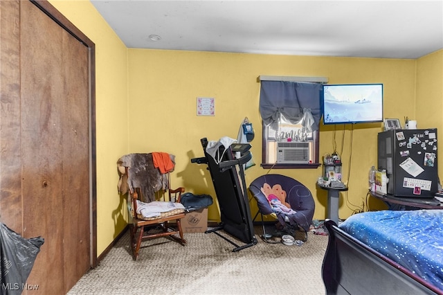 bedroom featuring cooling unit and carpet flooring