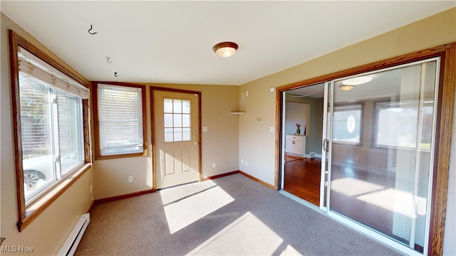 unfurnished sunroom featuring baseboard heating and lofted ceiling