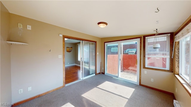 interior space featuring a baseboard heating unit