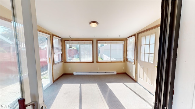 unfurnished sunroom featuring a baseboard radiator and lofted ceiling