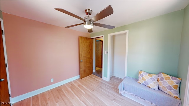 unfurnished bedroom with ceiling fan and light wood-type flooring