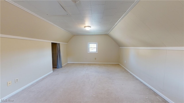 additional living space with light carpet and lofted ceiling