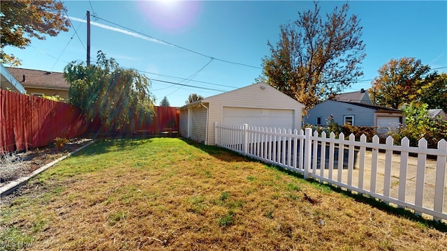 view of yard featuring an outbuilding and a garage