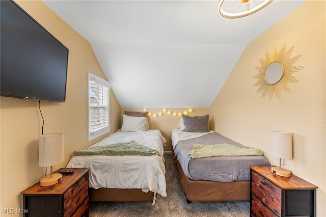 bedroom with vaulted ceiling and carpet floors