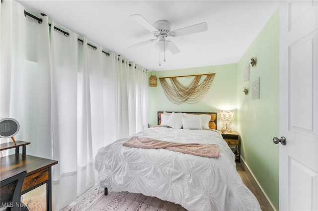 bedroom featuring ceiling fan and light hardwood / wood-style flooring