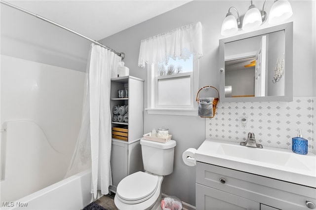 full bathroom featuring vanity, shower / tub combo, decorative backsplash, and toilet