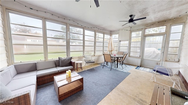 sunroom / solarium featuring ceiling fan and plenty of natural light