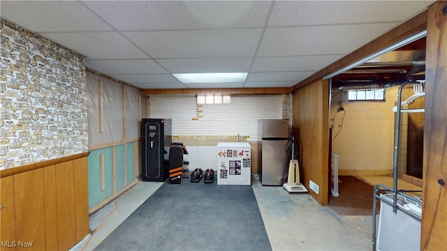 basement featuring a drop ceiling