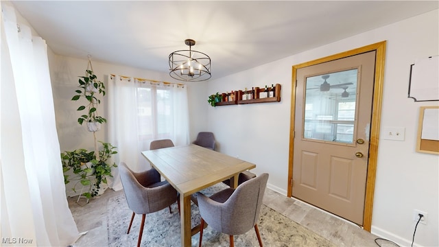 dining area featuring a notable chandelier