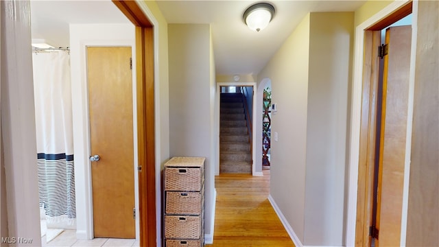 corridor with light wood-type flooring