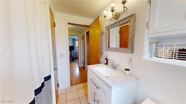 bathroom featuring vanity and hardwood / wood-style flooring