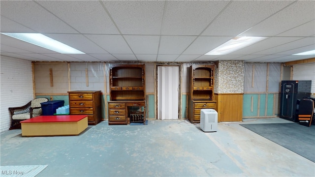 basement featuring a drop ceiling