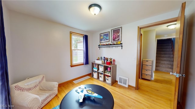 game room featuring hardwood / wood-style flooring