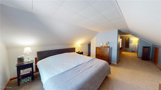 bedroom with lofted ceiling and carpet