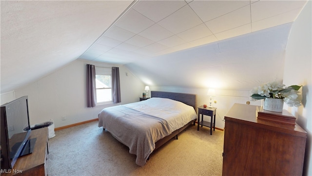 carpeted bedroom featuring lofted ceiling