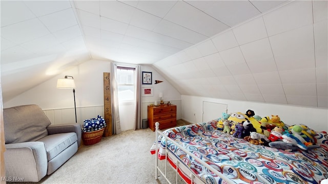 bedroom featuring vaulted ceiling and carpet floors