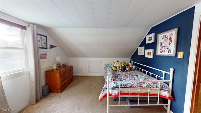 bedroom with carpet and vaulted ceiling