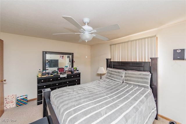 bedroom with ceiling fan and carpet