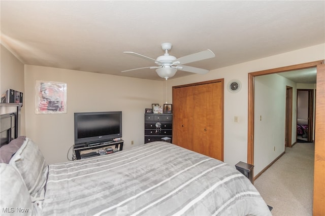 bedroom with light carpet and ceiling fan