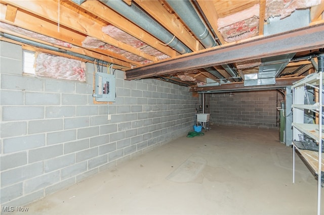 basement with electric panel and sink