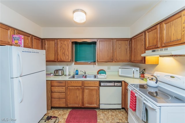 kitchen with sink and white appliances