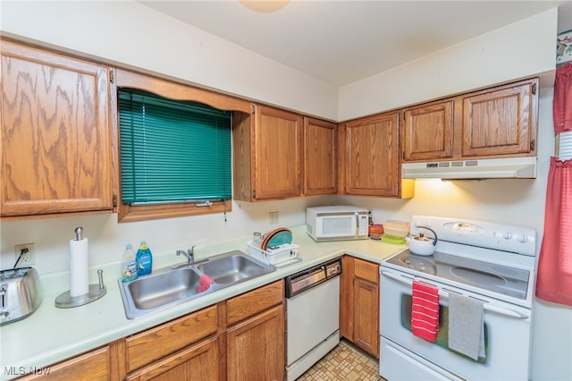 kitchen featuring sink and white appliances