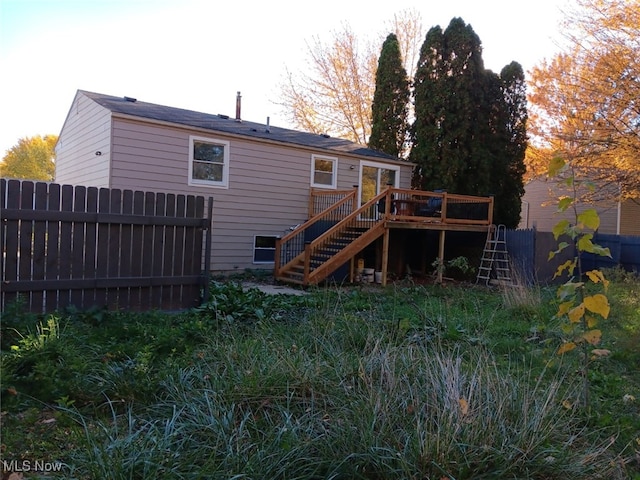 rear view of house with a wooden deck