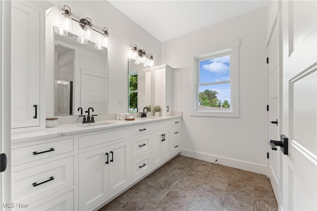 bathroom with vanity and an enclosed shower