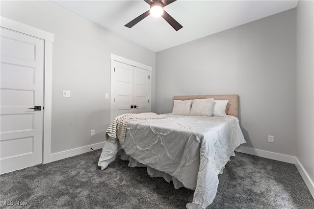 carpeted bedroom featuring a closet and ceiling fan