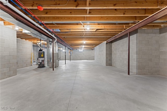 basement with water heater and heating unit