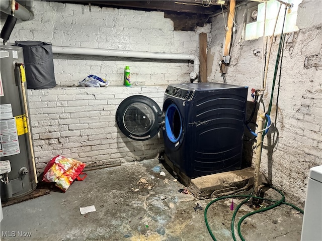 interior space with gas water heater and washing machine and dryer