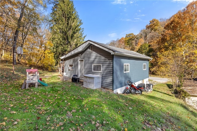 view of home's exterior with a yard