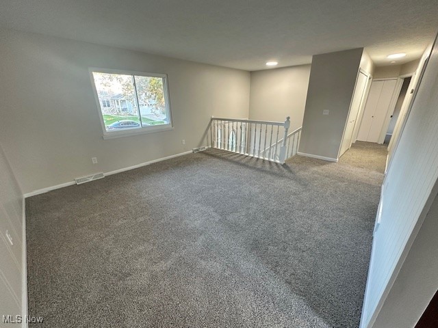 empty room with carpet flooring