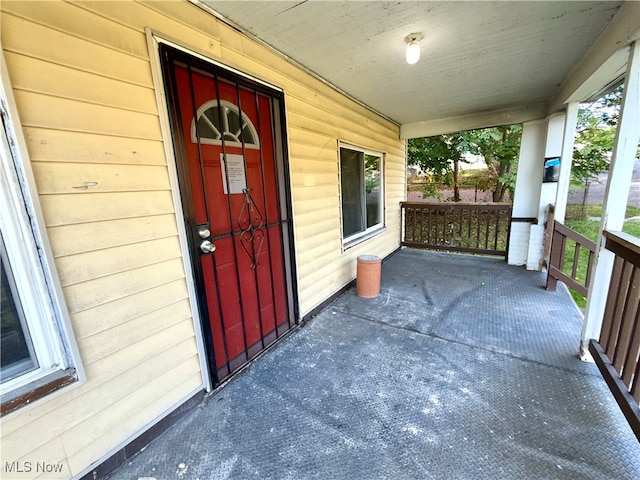 entrance to property with a porch