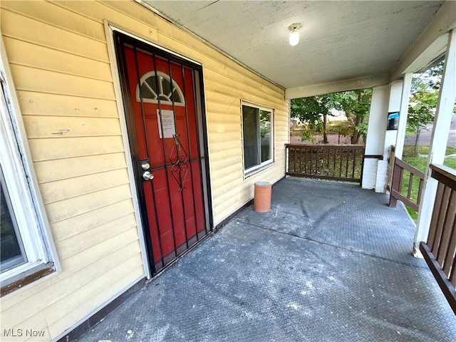 doorway to property with a porch