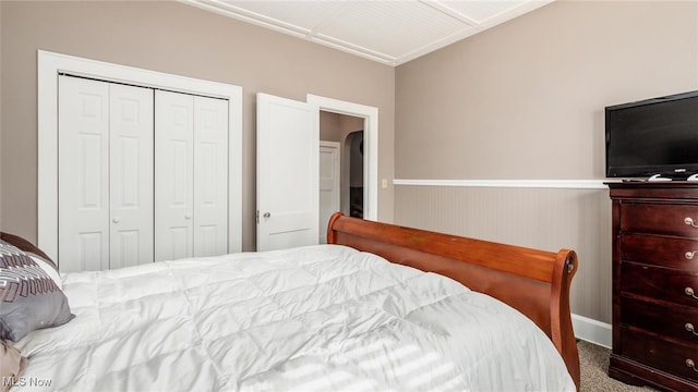 carpeted bedroom with a closet