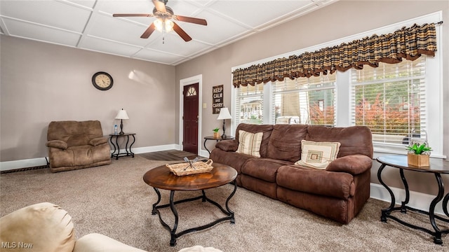 carpeted living room with ceiling fan