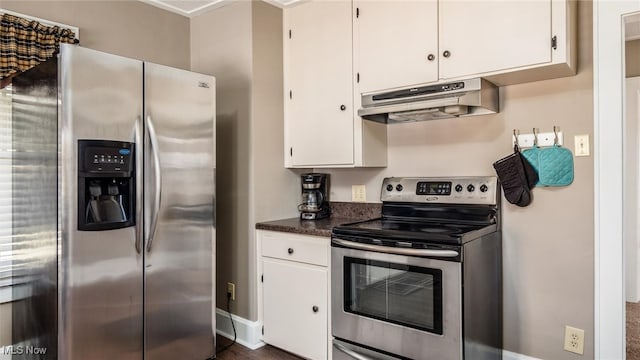 kitchen with appliances with stainless steel finishes and white cabinets