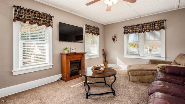 living room with carpet flooring and ceiling fan