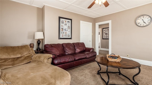 carpeted living room with ceiling fan