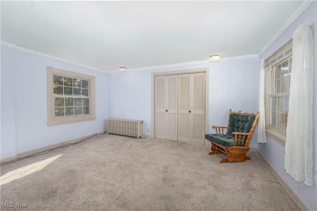 unfurnished room with crown molding, radiator heating unit, and carpet floors