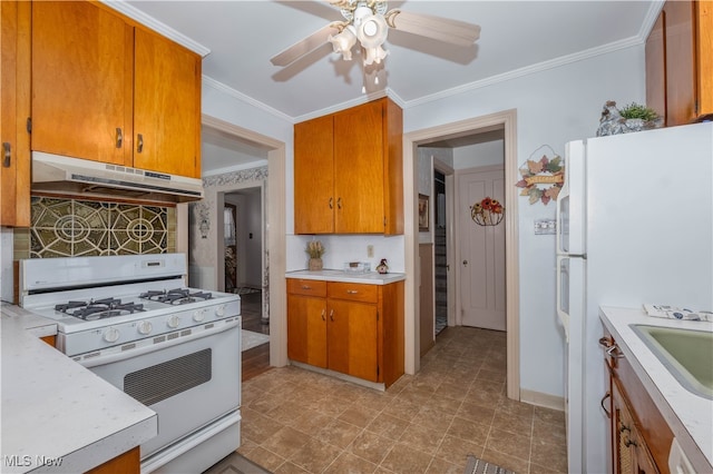 kitchen with sink, white appliances, ceiling fan, and ornamental molding