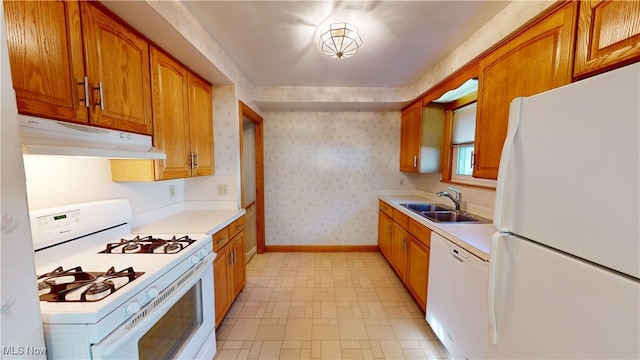 kitchen featuring sink and white appliances