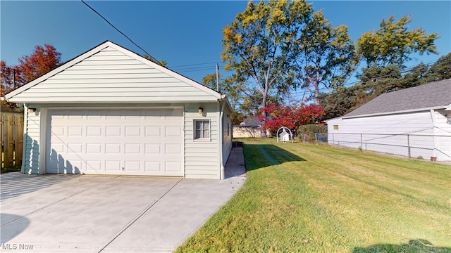 garage featuring a yard