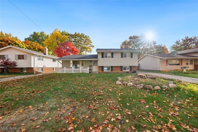 split level home with a front yard