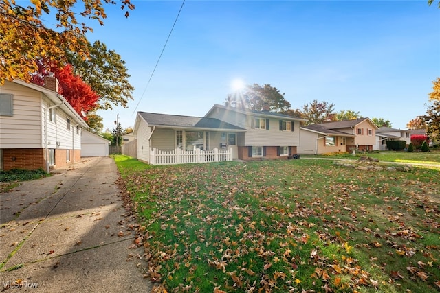 split level home with a front lawn